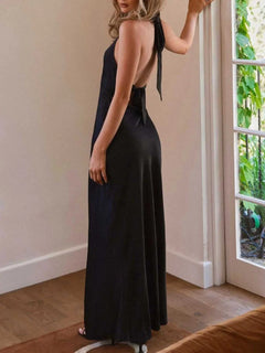 Halter neck wrap maxi dress with tie detail in black, non-stretch polyester, side view.
