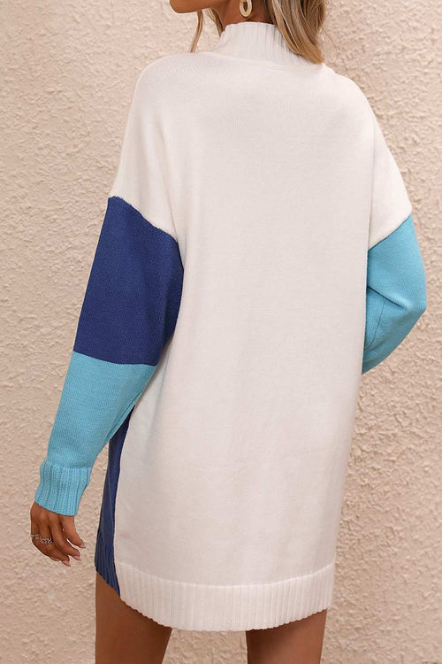 Back view of a color block mock neck sweater dress with dropped shoulders and long ribbed sleeves in white, navy, and light blue colors