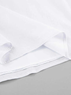 Close-up of white fabric lining detailing of a Ruffled V-Neck Maxi Dress made of 100% cotton with no stretch and frill features