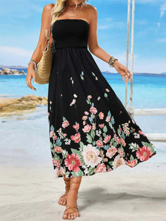 Printed tube midi dress with floral pattern, beach background.