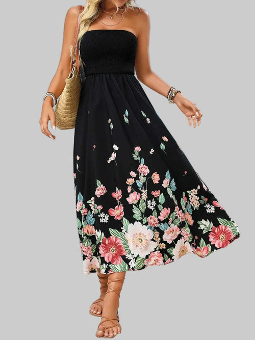 Printed tube midi dress with floral pattern, beach background.