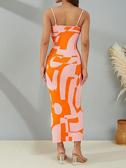 Spaghetti strap maxi sweater dress with abstract orange and pink pattern, showcasing a chic and cozy style.