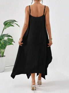 Black scoop neck midi cami dress with adjustable straps, worn by woman from back view.