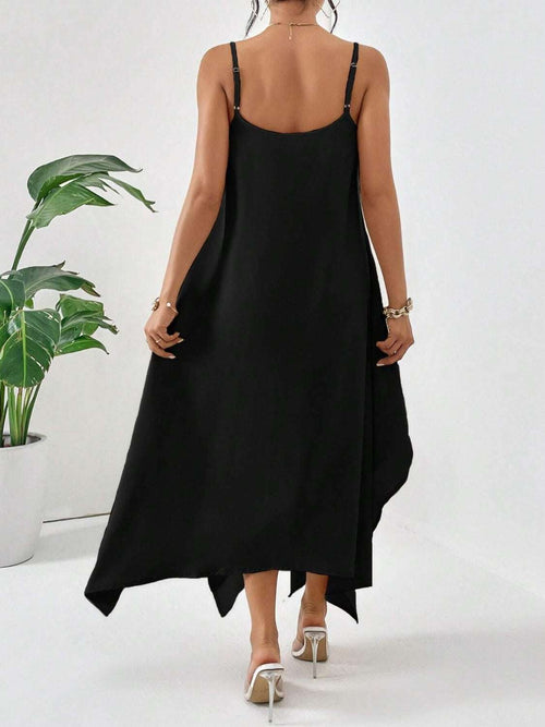 Black scoop neck midi cami dress with adjustable straps, worn by woman from back view.