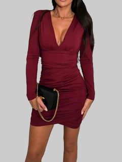 Ruched plunge long sleeve maroon wrap dress.