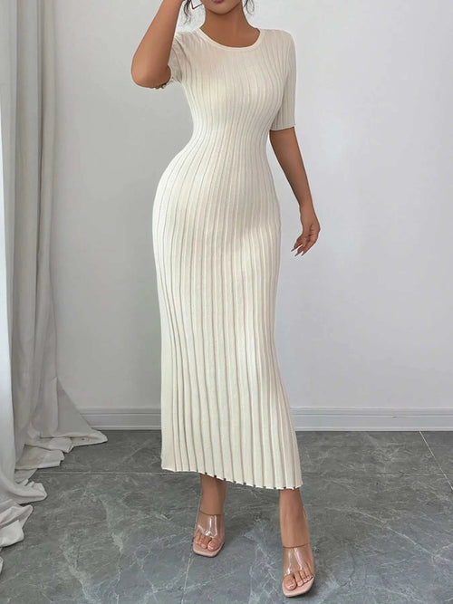 White ribbed round neck short sleeve sweater dress with moderate stretch, made of 100% viscose, styled in a fitted silhouette.