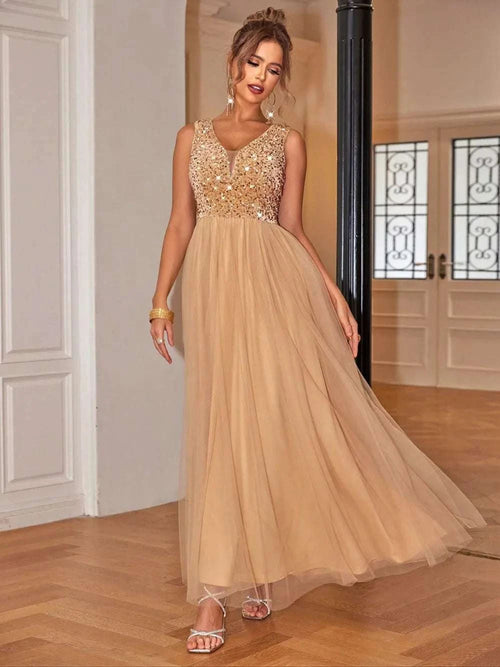 Sequin V-Neck Sleeveless Dress in gold with flowing skirt, styled on model.
