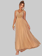 Sequin V-Neck Sleeveless Dress in gold with flowing skirt, styled on model.