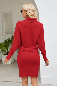 Woman wearing a red long sleeve mock neck ribbed dress from the back