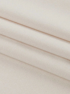Close-up of beige polyester fabric for asymmetrical tied sleeveless maxi dress
