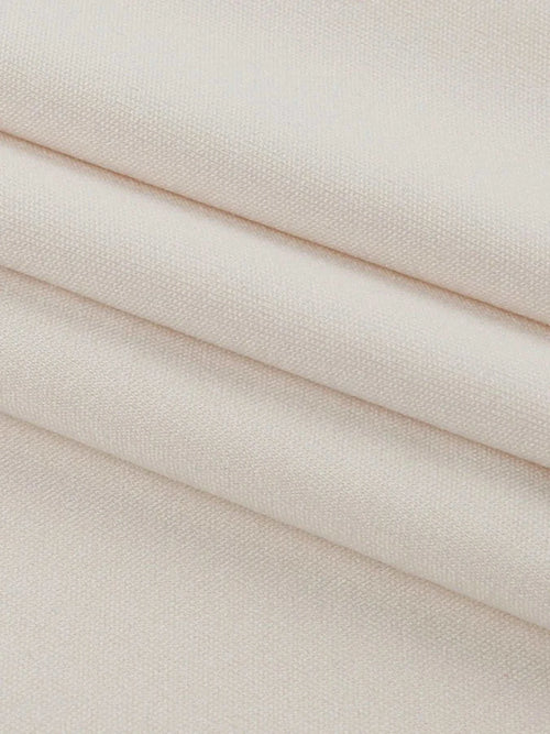 Close-up of beige polyester fabric for asymmetrical tied sleeveless maxi dress
