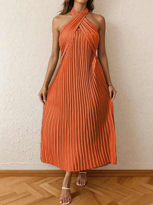 Orange pleated halter neck midi dress with a tied neckline and no stretch, made of 100% polyester.