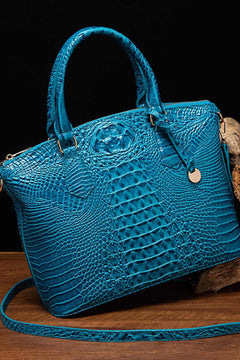 Blue PU leather handbag with crocodile texture and gold-tone hardware, medium-sized with handles and detachable strap.