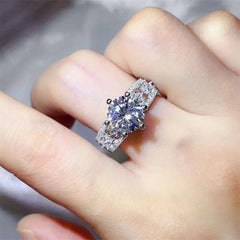 3 Carat Moissanite Ring in 925 Sterling Silver with zircon accent stones on finger