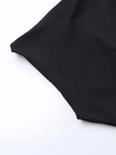 Black asymmetrical tied sleeveless maxi dress detail shot