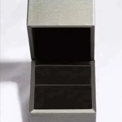 Silver jewelry box with black interior for 1 carat moissanite ring storage