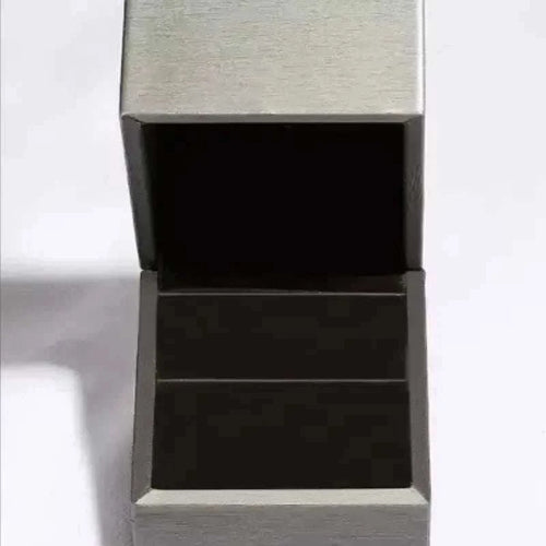 Silver jewelry box with black interior for 1 carat moissanite ring storage