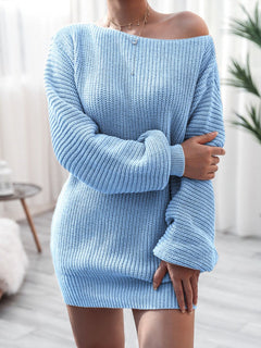 Light blue rib-knit mini sweater dress with long sleeves and off-shoulder design, shown on a model in a bright indoor setting