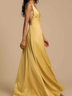 Yellow deep V-neck maxi dress with a backless crisscross design and slightly stretchy polyester fabric