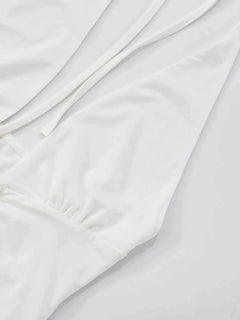 Ruffled hem halter neck mini dress, white, slightly stretchy polyester, backless design.