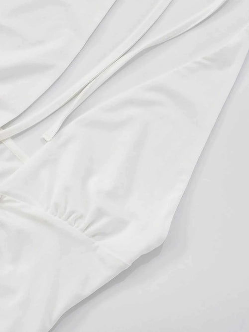 Ruffled hem halter neck mini dress, white, slightly stretchy polyester, backless design.