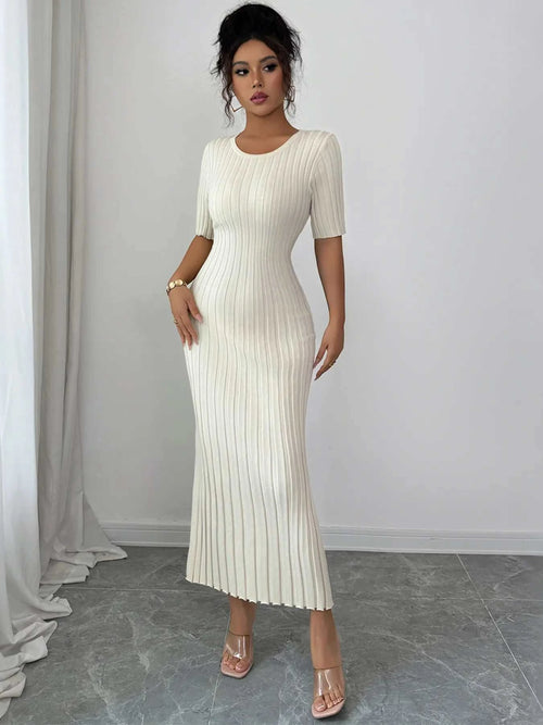 woman wearing white ribbed round neck short sleeve sweater dress midi length
