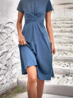 Blue Surplice Sleeveless Wrap Dress with slight stretch and machine washable polyester fabric