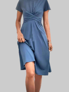 Blue Surplice Sleeveless Wrap Dress with slight stretch and machine washable polyester fabric