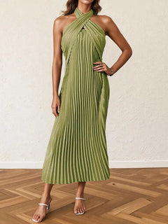 Green pleated halter neck midi dress with tied neckline and sleeveless design