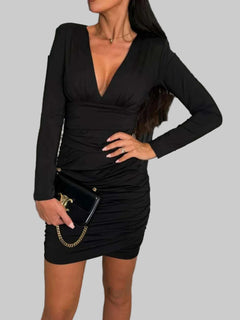 Ruched plunge long sleeve wrap dress in black with slight stretch.