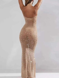 Back view of a nude rhinestone spaghetti strap maxi dress with slight stretch and basic style
