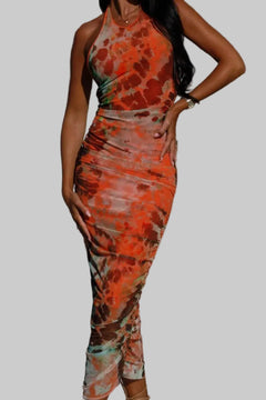 Backless printed halter neck dress in vibrant colors.