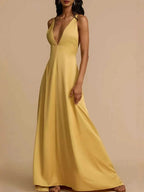 Yellow deep V-neck maxi dress with backless crisscross design and slightly stretchy polyester fabric