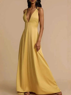 Yellow deep V-neck maxi dress with backless crisscross design and slightly stretchy polyester fabric