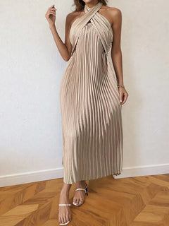 Beige pleated halter neck midi dress with tied neckline and no stretch fabric.