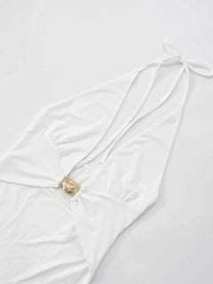 Ruffled hem halter neck mini dress in white with a backless design, made of slightly stretchy polyester.