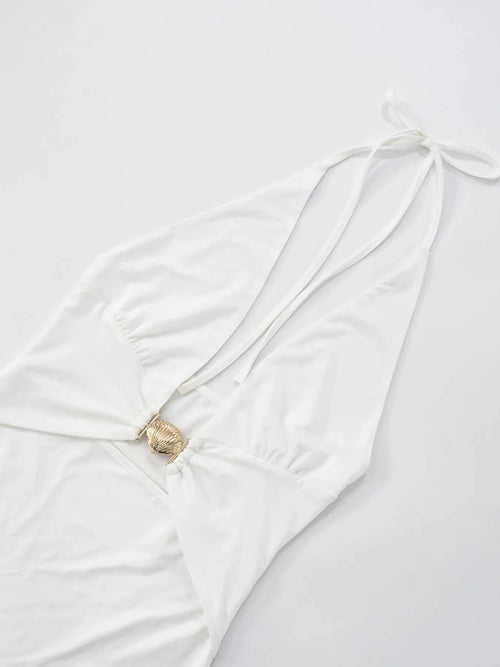 Ruffled hem halter neck mini dress in white with a backless design, made of slightly stretchy polyester.