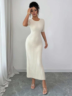 Woman wearing ribbed round neck short sleeve white sweater dress with moderate stretch