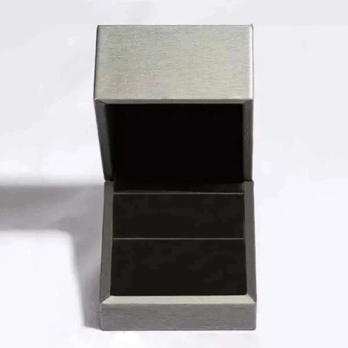 Open silver ring box for 3 carat moissanite ring display.