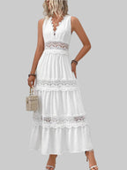 Woman wearing a white lace dress in a bright room.