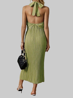 Green pleated halter neck midi dress with tied back and no stretch, made of 100% polyester.