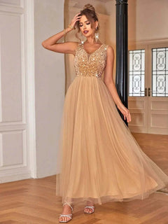 Sequin V-Neck sleeveless dress with lined body and sheer overlay.
