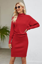 Woman wearing a chic red ribbed mock neck long sleeve dress with a bodycon silhouette and sunglasses