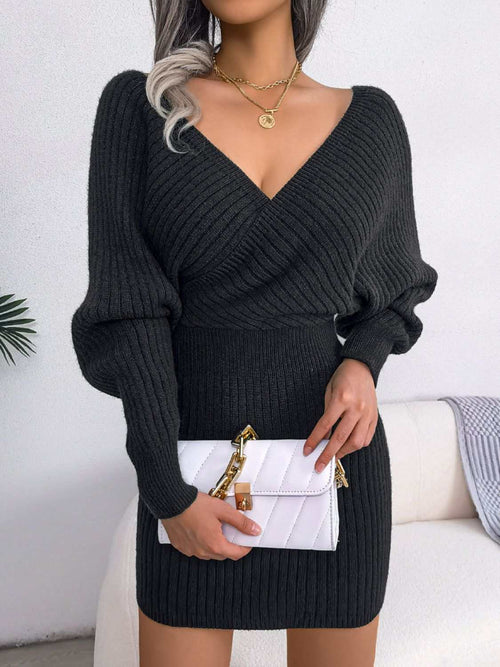 Black rib-knit dolman sleeve mini sweater dress with surplice neckline and A-line hem, casual style
