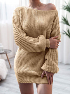 Beige rib-knit mini sweater dress with slightly stretchy fabric and long sleeves, featuring a relaxed fit and off-shoulder neckline, made of 100% acrylic.
