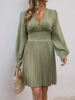 Olive green pleated long sleeve V-neck dress with slightly stretchy polyester fabric and zipper detail