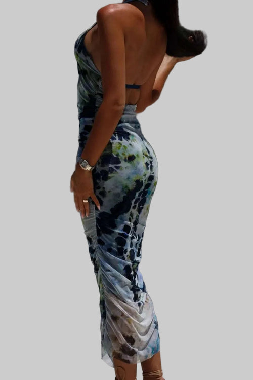 Backless printed halter neck dress in vibrant colors, made from 100% polyester, styled without a stretch, perfect for warm weather.