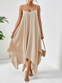 Beige scoop neck midi cami dress with asymmetrical hem, sleeveless and flowy design.