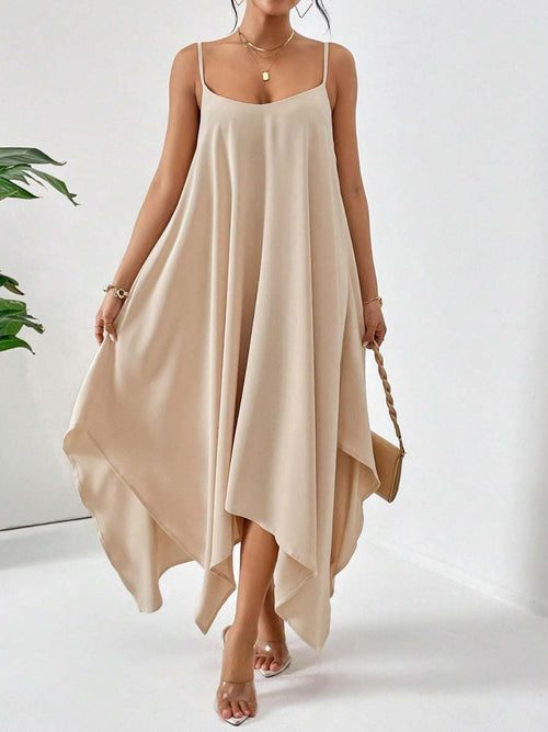 Beige scoop neck midi cami dress with asymmetrical hem, sleeveless and flowy design.