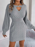Gray cable-knit cutout round neck slit sweater dress with long sleeves and fitted waist.